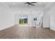 Open floor plan with kitchen island and modern light fixtures at 10071 Kingsville Dr, Port Charlotte, FL 33981