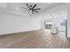 Open concept living room with hardwood floors and access to backyard at 10071 Kingsville Dr, Port Charlotte, FL 33981