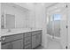 Modern bathroom with double vanity and shower at 17351 Peregrine Way, Punta Gorda, FL 33982