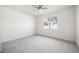 Bright bedroom with carpeted floor and large window at 37501 Williamette Way, Zephyrhills, FL 33540