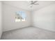 Spacious bedroom featuring neutral wall paint and carpet at 37501 Williamette Way, Zephyrhills, FL 33540