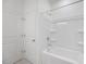 Clean bathroom with a shower/tub combo and white tile at 37508 Williamette Way, Zephyrhills, FL 33540