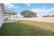 Spacious backyard with a vinyl fence and a covered patio at 37513 Williamette Way, Zephyrhills, FL 33540