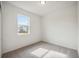 Bright bedroom with grey carpet and a window at 37513 Williamette Way, Zephyrhills, FL 33540