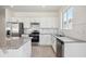 Modern kitchen with stainless steel appliances and granite countertops at 37513 Williamette Way, Zephyrhills, FL 33540