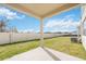 Covered patio overlooking a fenced-in backyard at 37736 Yukon Dr, Zephyrhills, FL 33540