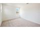 Small bedroom with a window and neutral carpet at 37736 Yukon Dr, Zephyrhills, FL 33540