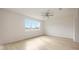 Large bedroom with light wood flooring and large window at 37736 Yukon Dr, Zephyrhills, FL 33540