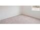 Simple bedroom with neutral wall and carpet at 37736 Yukon Dr, Zephyrhills, FL 33540