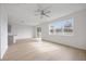 Bright living room with large windows and light wood floors at 37736 Yukon Dr, Zephyrhills, FL 33540