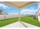 Covered patio overlooking a fenced-in backyard at 37736 Yukon Dr, Zephyrhills, FL 33540