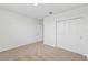 Well-lit bedroom featuring neutral walls and carpet flooring at 7760 Gilchrist Springs Dr, Parrish, FL 34219
