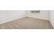 Well-lit bedroom with carpeted floor and window at 7760 Gilchrist Springs Dr, Parrish, FL 34219