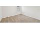 Bright bedroom with neutral walls and carpet flooring at 7760 Gilchrist Springs Dr, Parrish, FL 34219