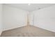 Well-lit bedroom with neutral walls and carpet flooring at 7760 Gilchrist Springs Dr, Parrish, FL 34219