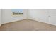 Bright bedroom featuring a window and carpet flooring at 7760 Gilchrist Springs Dr, Parrish, FL 34219