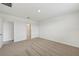 Carpeted bedroom with access to a bathroom at 7760 Gilchrist Springs Dr, Parrish, FL 34219