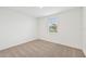 Bright bedroom with neutral carpeting and a window with blinds at 7760 Gilchrist Springs Dr, Parrish, FL 34219