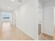 Bright hallway with tile flooring and doors leading to other rooms at 7760 Gilchrist Springs Dr, Parrish, FL 34219
