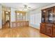 Bright dining area with built-in hutch and wood floors at 35935 Tanda Cir, Zephyrhills, FL 33541