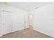 Bedroom with double door closet and neutral carpet flooring at 444 Lazy Shore Dr, Nokomis, FL 34275