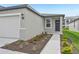 Front entrance with walkway and landscaping at 444 Lazy Shore Dr, Nokomis, FL 34275