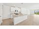 Modern kitchen with granite countertops and a breakfast bar at 444 Lazy Shore Dr, Nokomis, FL 34275