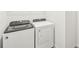 Laundry room with Whirlpool washer and dryer at 444 Lazy Shore Dr, Nokomis, FL 34275