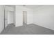 Simple bedroom with grey carpet and access to a bathroom at 184 Lazy Shore Dr, Nokomis, FL 34275