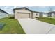 New construction home with a driveway and landscaped front yard at 184 Lazy Shore Dr, Nokomis, FL 34275