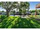 Large backyard with canal access and lush grass at 14914 Capri Ln, Hudson, FL 34667