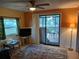 Living room with sliding glass doors to patio at 14914 Capri Ln, Hudson, FL 34667