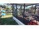 Screened porch with water view and seating at 14914 Capri Ln, Hudson, FL 34667