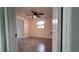 Spacious bedroom with ceiling fan and grey flooring at 4652 Alma St, New Port Richey, FL 34652