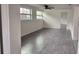 Living room with ceiling fan and grey flooring at 4652 Alma St, New Port Richey, FL 34652