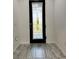 Interior entryway with tile floor and door at 8394 Olive Brook Dr, Wesley Chapel, FL 33545