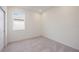 Bright bedroom with neutral carpeting and large window at 37545 Mackenzie Dr, Zephyrhills, FL 33540