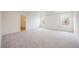 Large bedroom with carpet, neutral walls, and natural light at 37545 Mackenzie Dr, Zephyrhills, FL 33540