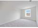Bright bedroom with large window and neutral carpet at 37545 Mackenzie Dr, Zephyrhills, FL 33540