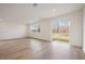 Bright living room with hardwood floors and access to backyard at 37545 Mackenzie Dr, Zephyrhills, FL 33540
