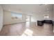 Spacious living room with hardwood floors and sliding glass doors at 37545 Mackenzie Dr, Zephyrhills, FL 33540