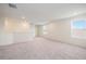 Spacious loft area with carpet and two windows at 37545 Mackenzie Dr, Zephyrhills, FL 33540