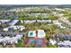 An aerial view showcasing the community's pool, tennis court, mature landscaping, and convenient parking at 2814 Somerset Park Dr # 202, Tampa, FL 33613