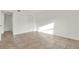 A bright bedroom features neutral tile flooring, a closet and white walls at 2814 Somerset Park Dr # 202, Tampa, FL 33613