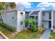 Inviting condo building with lush landscaping, tiled roof, and private balconies at 2814 Somerset Park Dr # 202, Tampa, FL 33613