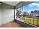 A screened porch features a nice view of green space and blue sky at 2814 Somerset Park Dr # 202, Tampa, FL 33613