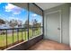 A screened porch features a nice view of green space and blue sky at 2814 Somerset Park Dr # 202, Tampa, FL 33613