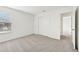 Bright bedroom with window, closet, and carpet flooring at 14045 Crutchfield Ct, Parrish, FL 34219