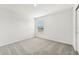 Well-lit bedroom with carpet flooring and window with blinds at 14045 Crutchfield Ct, Parrish, FL 34219