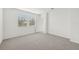 Bedroom with neutral walls, carpet, and two windows at 14045 Crutchfield Ct, Parrish, FL 34219